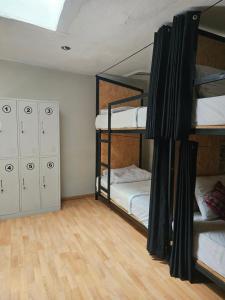 Voodi või voodid majutusasutuse Xplora Hostel Cusco toas