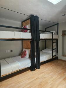 Voodi või voodid majutusasutuse Xplora Hostel Cusco toas