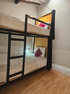 Voodi või voodid majutusasutuse Xplora Hostel Cusco toas