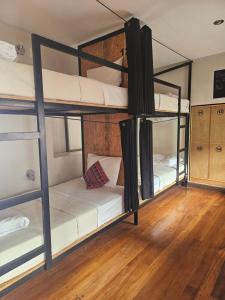 Voodi või voodid majutusasutuse Xplora Hostel Cusco toas