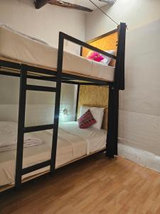 Voodi või voodid majutusasutuse Xplora Hostel Cusco toas