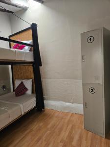 Voodi või voodid majutusasutuse Xplora Hostel Cusco toas