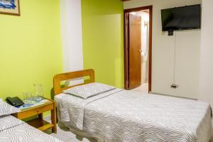 Postel nebo postele na pokoji v ubytování Hotel Veleros Cartagena