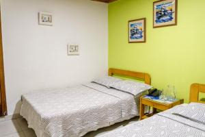 Postel nebo postele na pokoji v ubytování Hotel Veleros Cartagena