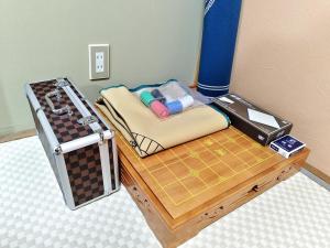 a toy room with a chess board and a table at Green Oasis Cottage A in Hakone