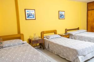 Postel nebo postele na pokoji v ubytování Hotel Veleros Cartagena