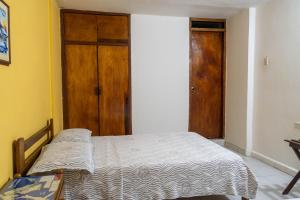 Postel nebo postele na pokoji v ubytování Hotel Veleros Cartagena