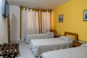 Postel nebo postele na pokoji v ubytování Hotel Veleros Cartagena
