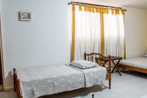 Postel nebo postele na pokoji v ubytování Hotel Veleros Cartagena