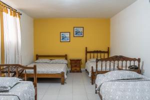 Postel nebo postele na pokoji v ubytování Hotel Veleros Cartagena