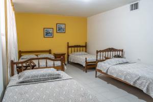 Postel nebo postele na pokoji v ubytování Hotel Veleros Cartagena