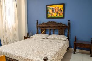 Postel nebo postele na pokoji v ubytování Hotel Veleros Cartagena