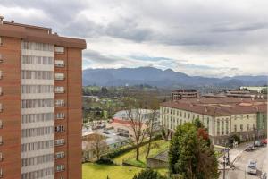 a view of a city with mountains in the background at AH Full&Roomy Auditorio de Oviedo VUT6502AS in Oviedo