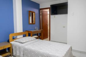 Postel nebo postele na pokoji v ubytování Hotel Veleros Cartagena