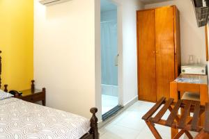 Postel nebo postele na pokoji v ubytování Hotel Veleros Cartagena