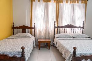 Postel nebo postele na pokoji v ubytování Hotel Veleros Cartagena