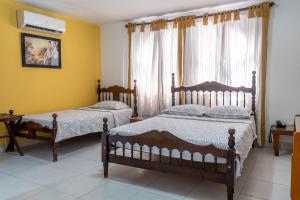 Postel nebo postele na pokoji v ubytování Hotel Veleros Cartagena