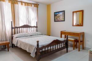 Postel nebo postele na pokoji v ubytování Hotel Veleros Cartagena