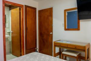 Postel nebo postele na pokoji v ubytování Hotel Veleros Cartagena