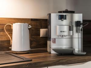 a coffee maker sitting on a counter next to a coffeemaker at Holiday apartment by the lake in Bad Zwischenahn