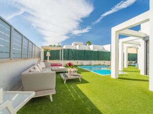 a living room with a couch and a table at Tampa Bay V3C1 with Private Pool in Santa Margalida