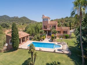 an exterior view of a house with a swimming pool at Palleta S'Horta near Cala Mondragó Beach in Felanitx
