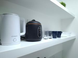 a toaster sitting on a shelf in a kitchen at Boracay Luxury Apartments in Boracay