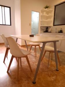a dining table and chairs in a room at Boracay Luxury Apartments in Boracay