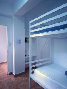 a bedroom with a bunk bed with a ladder at Boracay Luxury Apartments in Boracay