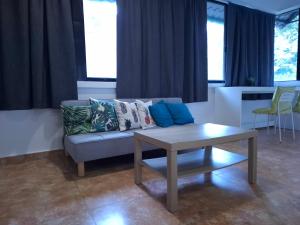 a living room with a couch and a table at Boracay Luxury Apartments in Boracay