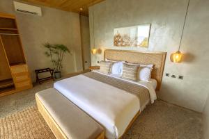 Rúm í herbergi á Manami Resort