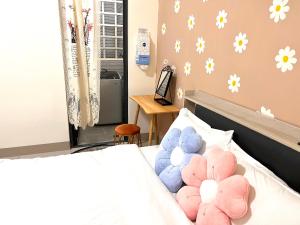 A bed or beds in a room at Daisy's Hsiang Hola