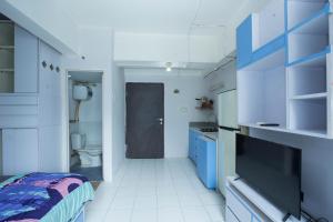 Μια τηλεόραση ή/και κέντρο ψυχαγωγίας στο Apartemen Jarrdin Cihampelas B 2223 By PROELIA INDONESIA