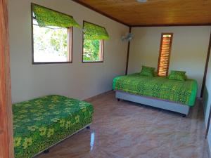 Postel nebo postele na pokoji v ubytování Chez HEIREVA