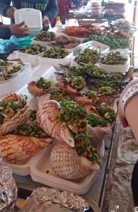 a buffet with many different types of food on plates at Vườn Dừa Cam Bình 1 in La Gi +30 photos
