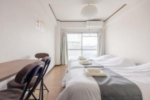 Murasaki Good Place House客房内的一张或多张床位