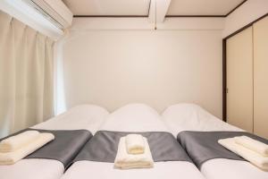 Murasaki Good Place House客房内的一张或多张床位