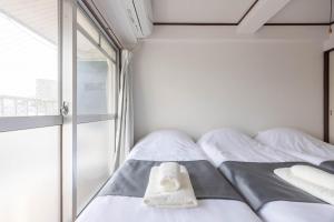 Murasaki Good Place House客房内的一张或多张床位