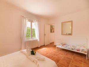 a bedroom with two beds and a window at Holiday Home Bona Mar with Pool in Cala Ratjada +24 photos