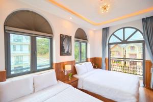 Letto o letti in una camera di Lotus Hotel Đà Lạt