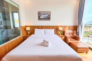 Letto o letti in una camera di Lotus Hotel Đà Lạt