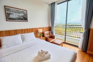 Letto o letti in una camera di Lotus Hotel Đà Lạt