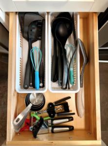 a drawer full of kitchen utensils in a cabinet at Modern 3BR Near Airport & DT in Calgary