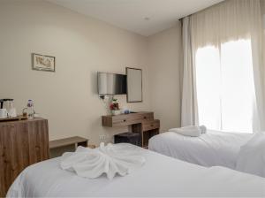 Lodge Pyramids View Hotel客房内的一张或多张床位