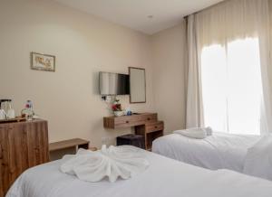 Lodge Pyramids View Hotel客房内的一张或多张床位