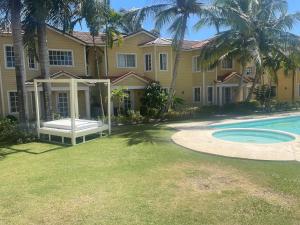 a house with a swimming pool in the yard at Mediterranean villa in paradise in Punta Cana