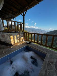 a hot tub on a patio with snow at Mambe refugio in Piedecuesta