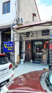 a building with a car parked in front of a store at Kazuki Boutique Accommodation in George Town +16 photos