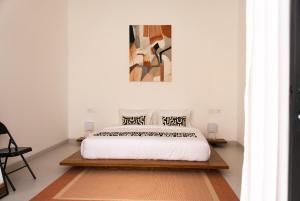 Postel nebo postele na pokoji v ubytování Maison Captier by OriVista, 6min Pererenan Beach + 28 fotografií