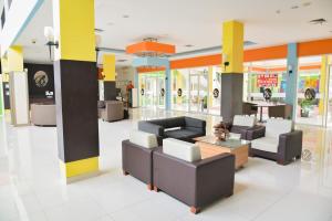 a lobby with couches and tables in a store at Hotel Bonero Residence in Bojonegoro